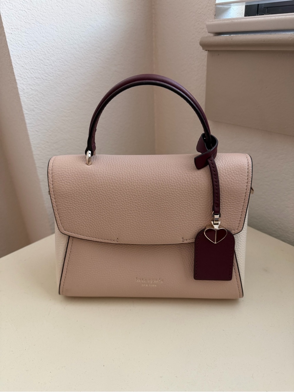 kate spade pink and burgundy pebbled leather top-handle satchel